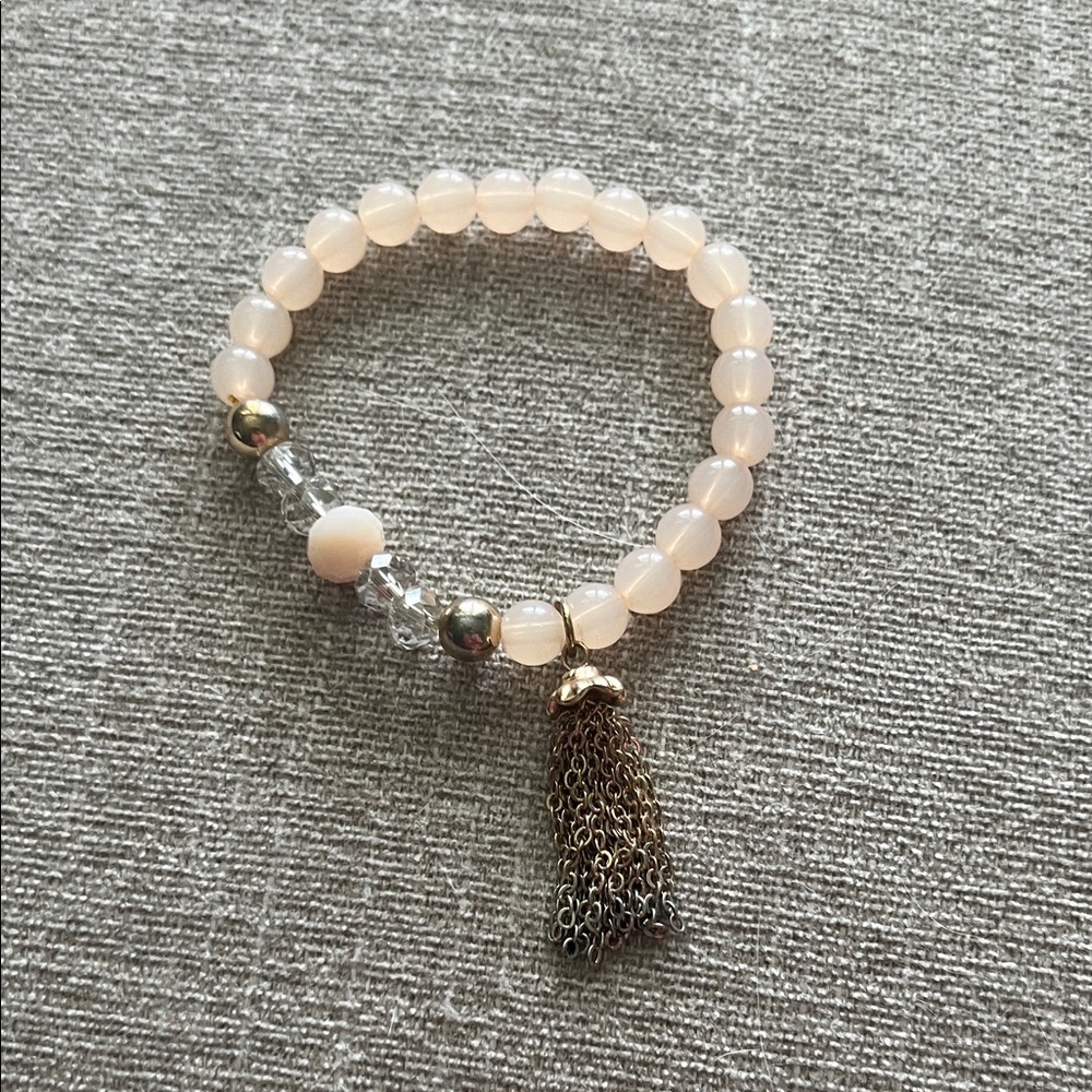 Elegant Cream Beaded Bracelet with Gold Tassel